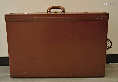 A contemporary brown leather dressing case with brass fittings, lined with brown fabric with