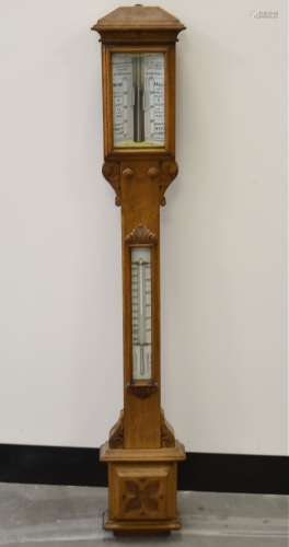 An Edwardian oak cased barometer, the segmented top with a register signed 'Pastorelli & Rapkin Ltd,