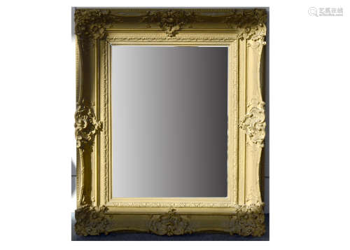 A 19th Century rectangular mirror, in swept gilt frame with scroll and shell decoration, 68cm x