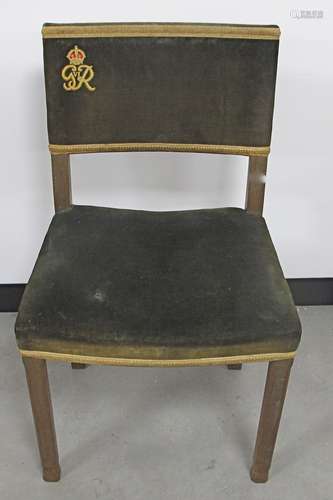 A George VI lined oak coronation chair, with green upholstery and monogram, gold braiding, stamped