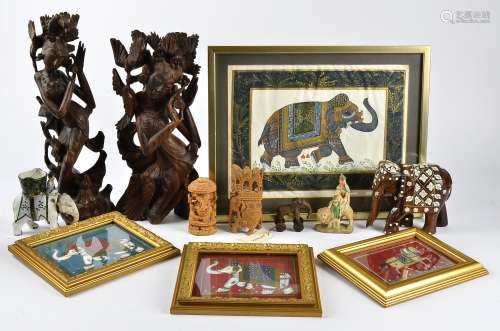 A collection of Indian and Balinese wooden carvings, of figures in traditional attire,