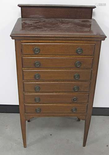 An Edwardian mahogany six-drawer music cabinet, tapered legs, moulded top, raised gallery back, 55cm