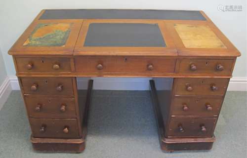 A 19th Century mahogany veneered pedestal writing desk, with moulded top, and lift up central