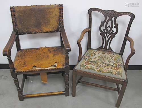A Victorian Georgian style arm chair, with carved back rail and drop in seat with tapestry cover,