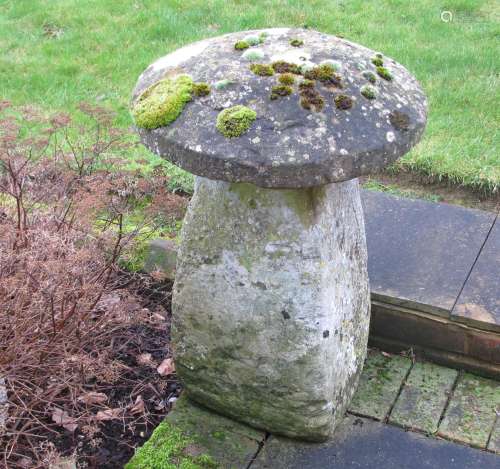 An antique staddle stone with cap, approximate diameter 56cm