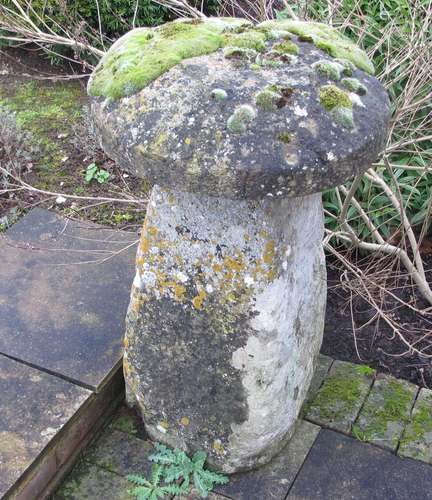 An antique staddle stone with cap, approximate diameter 56cm