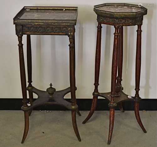 Two continental jardinière stands with marble tops and brass galleries, raised on fluted supports,
