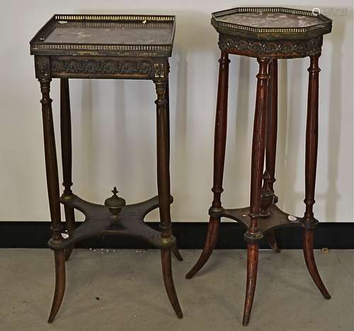 Two continental jardinière stands with marble tops and brass galleries, raised on fluted supports,