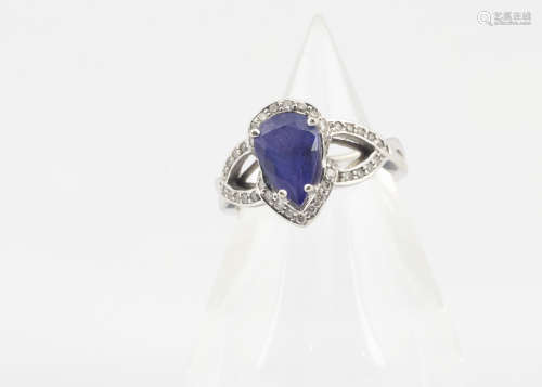 A continental 14ct gold tanzanite and diamond dress ring, the pear cut tanzanite in four claw