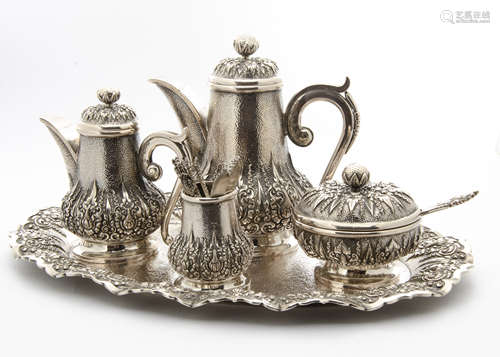 A c1960s Thai silver five piece coffee and tea set, comprising tray, teapot, coffee pot, covered