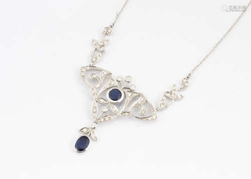 A contemporary sapphire and diamond necklace, the ornate openwork floral setting in the Art
