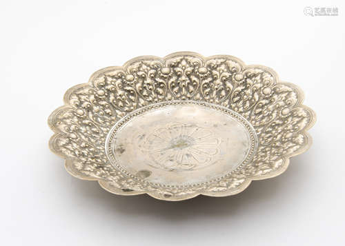 A Chinese silver dish, with raised floral designs, 11.6 ozt and 27cm wide, marked to underside