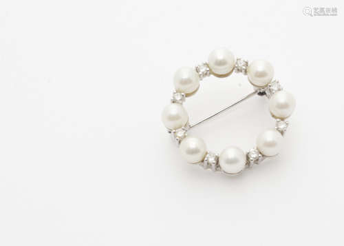 A continental white metal cultured pearl and diamond wreath brooch, with pin back marked 585 to