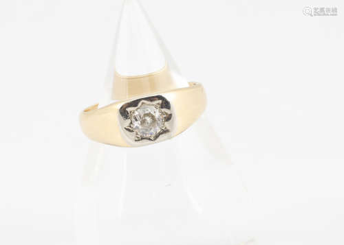 An Art Deco 18ct gold diamond set signet ring, the old cut diamond in gypsy white metal setting,