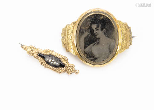 A 19th Century gilt mounted mourning brooch, converted from a bracelet, centred with a