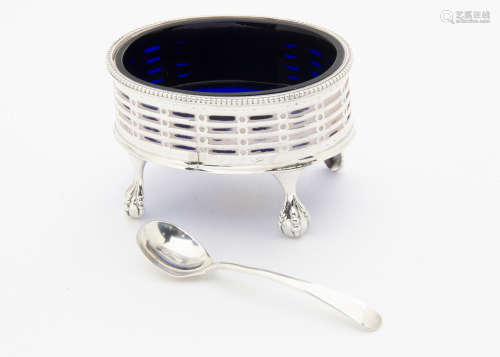 A George III silver table salt by Robert Hennell, oval with pierced sides, on four ball and claw