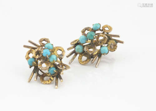 A pair of continental yellow metal and turquoise ear studs, marked 18k, the cabochon blue stones