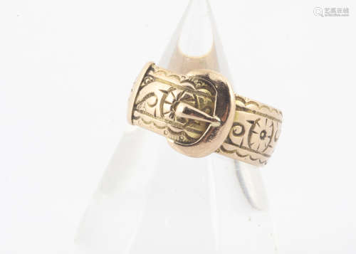 A George V 9ct gold buckle ring, with engraved decoration of flowers and scrolls, hallmarked to