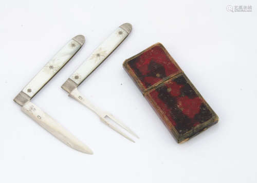 A cased George III silver and mother of pearl campaign knife and fork set, each folding with
