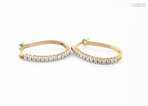 A pair of 9ct gold hoop earrings, the eight cut diamonds in white gold claw setting on a 9ct gold