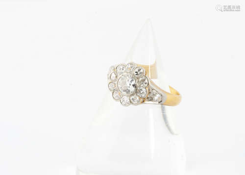 An Edwardian diamond set cluster ring, the central old cut in platinum setting approximately 0.45ct,