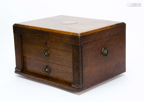 A part canteen of Old English pattern cutlery by Walker & Hall, presented in an oak box on stand