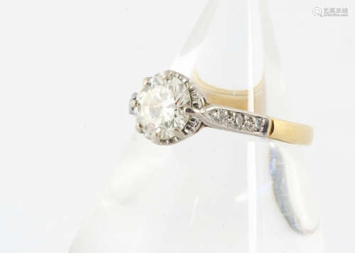 An 18ct gold, platinum and diamond set solitaire, the brilliant cut in claw setting, with diamond