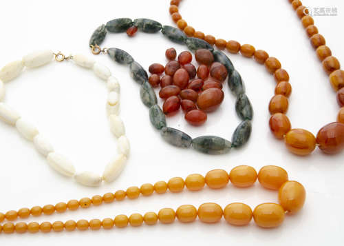 Two simulated amber graduated bead necklaces, a moss agate necklace and two other necklaces, one