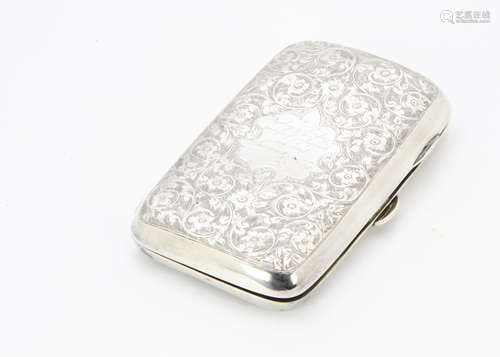 An Edwardian silver cigar case by TH, rectangular and curved with engraved scrolling foliage and