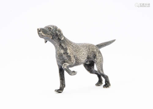 A 1970s silver model of a gun dog, naturalistically modelled on three legs as a pointer, London