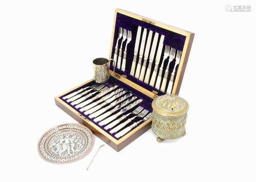 A vintage Indian silver and copper plate, together with a part set of mop handled dessert knives and