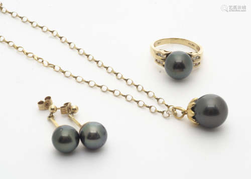 A 14ct gold Tahitian black pearl and diamond set dress ring, the spherical black pearl flanked by