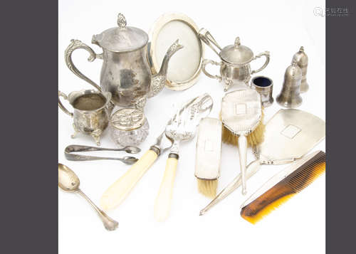 A small collection of silver and silver plate, including a circular photograph frame, four silver