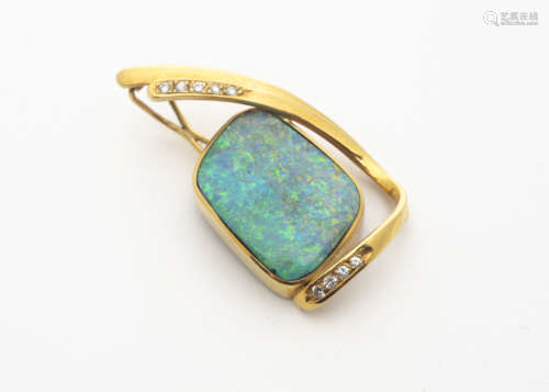 A continental black opal and diamond yellow metal pendant, marked 750, the large opal in a rubbed