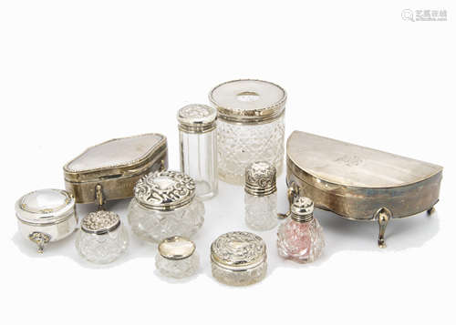 Two George V silver trinket boxes and eight cut glass and silver dressing tables, one demi-lune with