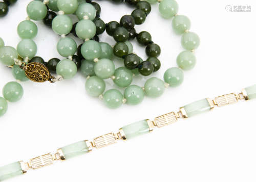 A 9ct gold and jade bracelet, the polished jade shaped rectangular links with gold spacers and
