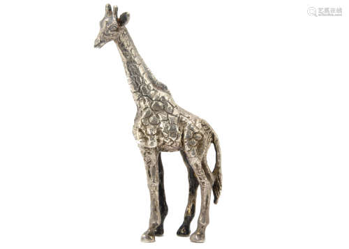 A modern silver sculpture of a giraffe by Patrick Mavros, naturalistically modelled in standing