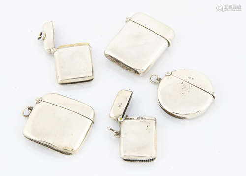 five late 19th and early 20th century silver vesta cases, each plain, including a circular