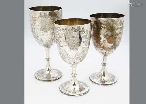 Three Victorian silver trophy goblets, one damaged, each won by Sylvia, all in 1877, from Weymouth