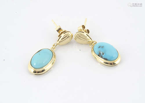 A pair of yellow metal and turquoise drop earrings, the oval polished cabochons in a plain collet