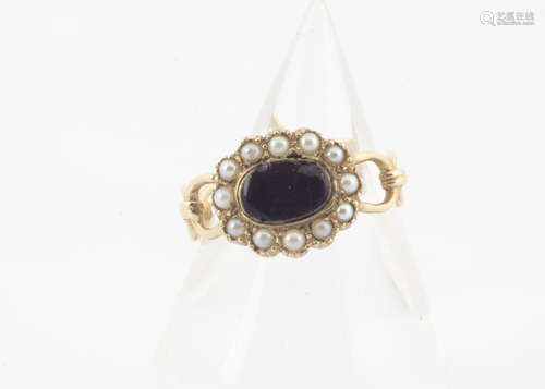 A 9ct gold enamel and seed pearl dress ring, in the style of an 18th Century mourning ring with oval