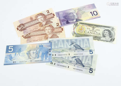 Seven Canadian bank notes, including a 1970s $1, two 1980s $2, three $5 and one £10