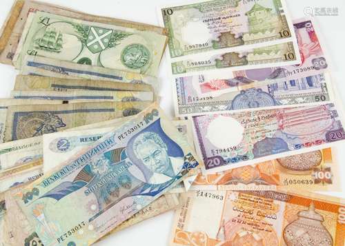 A small collection of world bank notes, with examples from Sri Lanka, Zambia, Ghana, and more (