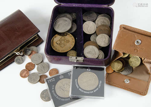 A small collection of coins, including a US 1882 dollar in keyring, two £5 coins, a £2 coin and more