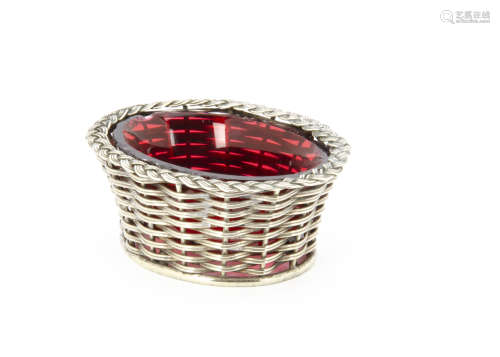 A late 19th century contiental silver basket salt, marked to base, 9cm wide, with red glass liner,