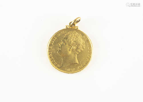 A George III gold two pound coin or double sovereign, dated 1823, unfortunately with applied