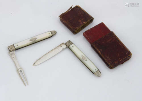 A cased George III silver and mother of pearl campaign knife and fork set, each folding with inset
