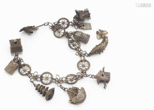 A Chinese silver charm bracelet, the stylised roundel links supporting eight charms including