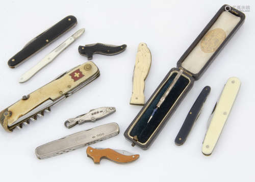 A collection of ten collectable pocket knives, one silver fish with knife and button hook, a