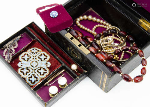 A 19th Century leather jewellery box, with a base metal and enamel belt buckle, various simulated